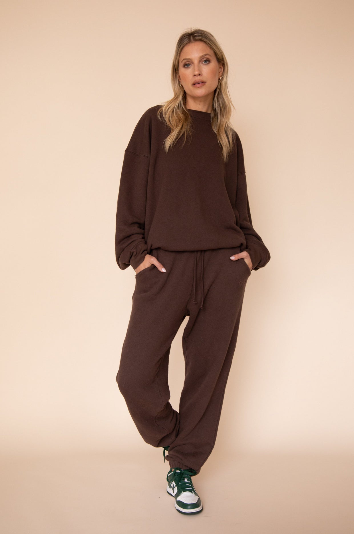 This is an image of Bodhi Sweat pants in Tobacco - RESA featuring a model wearing the dress