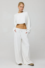 This is an image of Boyfriend Crop Rib in White - RESA featuring a model wearing the dress