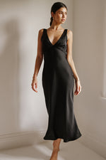 This is an image of Charlie Dress in Black - RESA featuring a model wearing the dress
