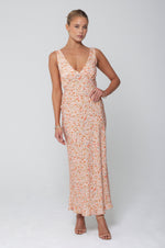 This is an image of Charlie Dress in Sunstone - RESA featuring a model wearing the dress