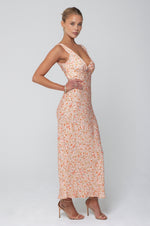 This is an image of Charlie Dress in Sunstone - RESA featuring a model wearing the dress