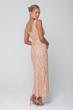This is an image of Charlie Dress in Sunstone - RESA featuring a model wearing the dress