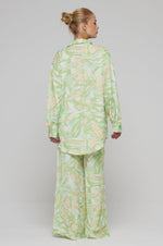 This is an image of Chase Pant in Limestone - RESA featuring a model wearing the dress