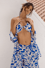 This is an image of Chase Pant in Pacific - RESA featuring a model wearing the dress
