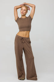 This is an image of Chase Rib Pant in Chai - RESA featuring a model wearing the dress