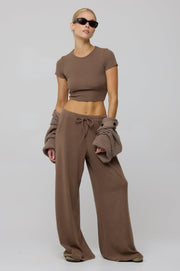 This is an image of Chase Rib Pant in Chai - RESA featuring a model wearing the dress