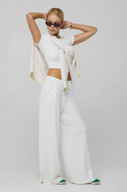 This is an image of Chase Rib Pant in White - RESA featuring a model wearing the dress