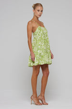 This is an image of Chloe Mini in Lotus - RESA featuring a model wearing the dress
