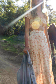This is an image of Daisy Top in Wildflower - RESA featuring a model wearing the dress