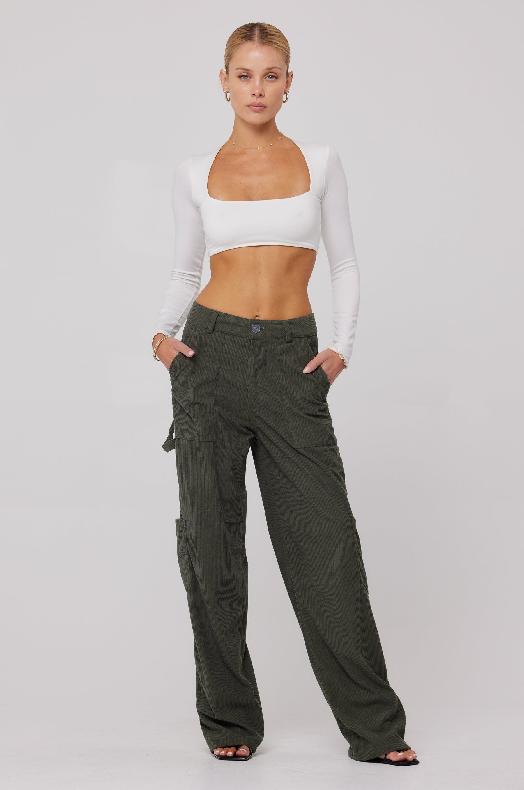 This is an image of Elsa Cargo Pant in Pine - RESA featuring a model wearing the dress