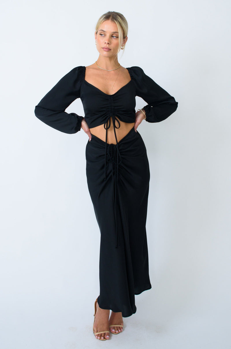 This is an image of Everly Blouse in Black - RESA featuring a model wearing the dress