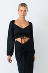 This is an image of Everly Blouse in Black - RESA featuring a model wearing the dress