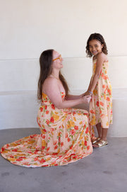 This is an image of Gabi Maxi in Ginger - RESA featuring a model wearing the dress