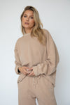 This is an image of Gunner Sweatshirt in Sand - RESA featuring a model wearing the dress