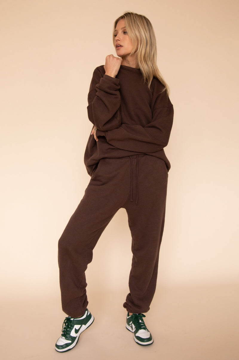 This is an image of Gunner Sweatshirt in Tobacco - RESA featuring a model wearing the dress