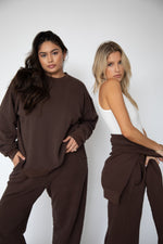 This is an image of Gunner Sweatshirt in Tobacco - RESA featuring a model wearing the dress