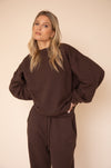 This is an image of Gunner Sweatshirt in Tobacco - RESA featuring a model wearing the dress