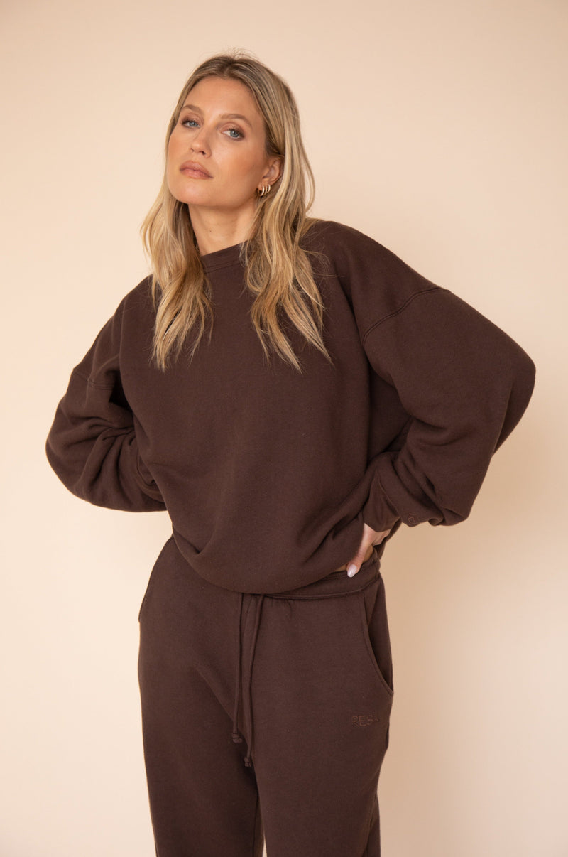 This is an image of Gunner Sweatshirt in Tobacco - RESA featuring a model wearing the dress