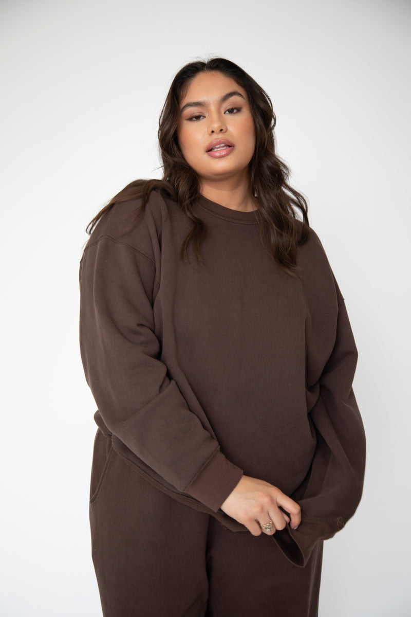 This is an image of Gunner Sweatshirt in Tobacco - RESA featuring a model wearing the dress