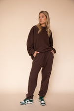 This is an image of Gunner Sweatshirt in Tobacco - RESA featuring a model wearing the dress