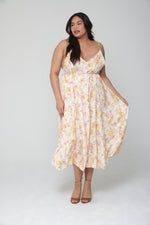 This is an image of Hannah Midi in Gardenia - RESA featuring a model wearing the dress