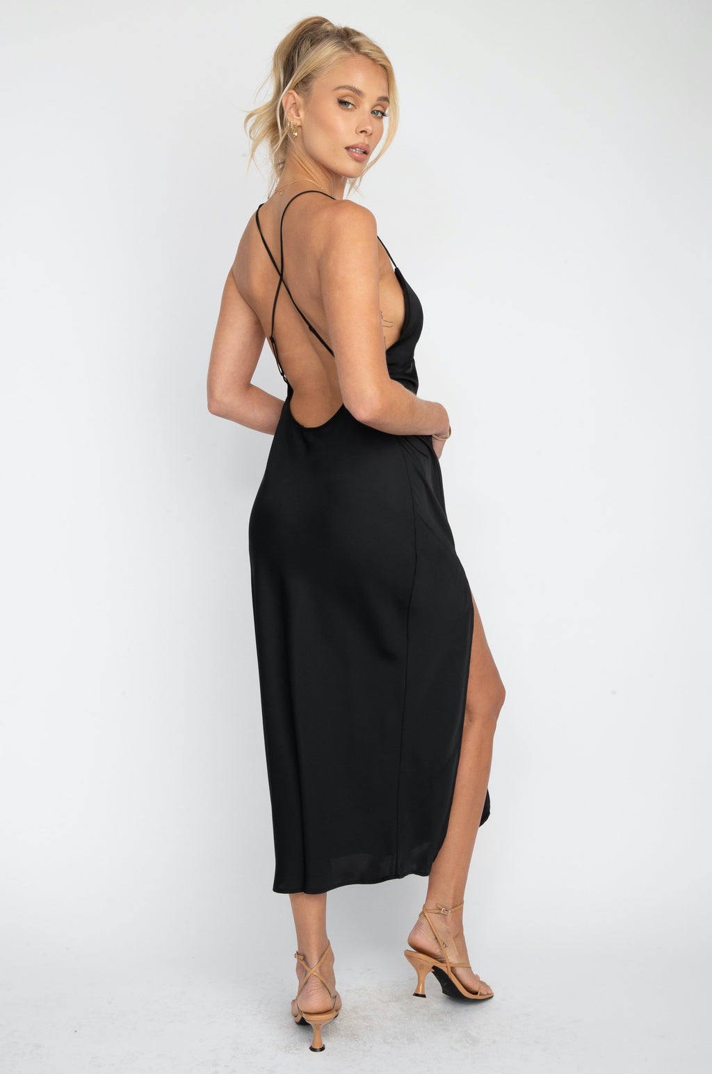 This is an image of Harper Slip Dress - RESA featuring a model wearing the dress
