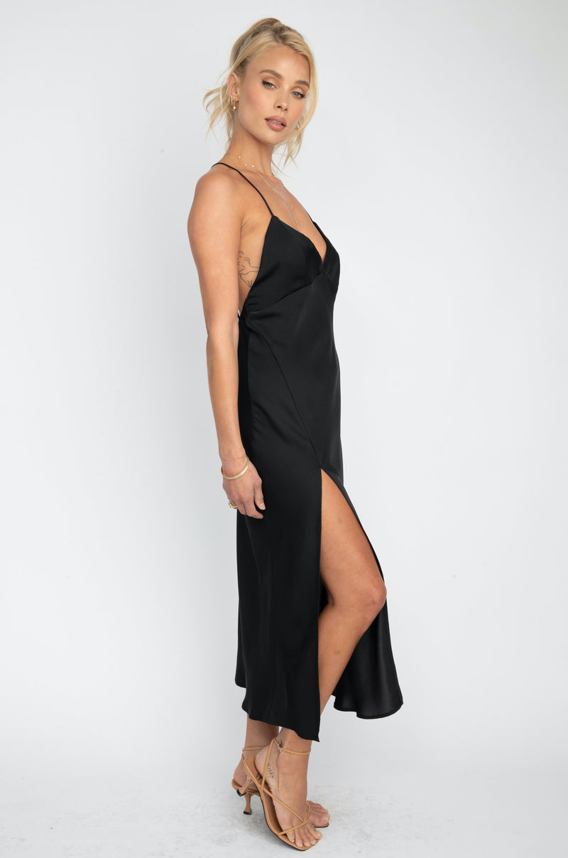 This is an image of Harper Slip Dress - RESA featuring a model wearing the dress