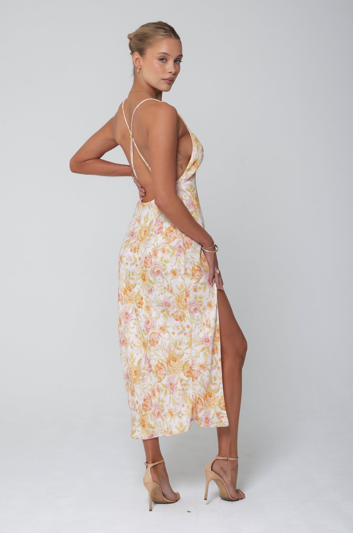 This is an image of Harper Slip in Gardenia - RESA featuring a model wearing the dress