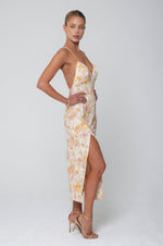 This is an image of Harper Slip in Gardenia - RESA featuring a model wearing the dress