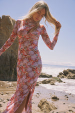 This is an image of Holly Maxi in Coral - RESA featuring a model wearing the dress