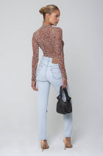 This is an image of Ida Top in Dallas - RESA featuring a model wearing the dress