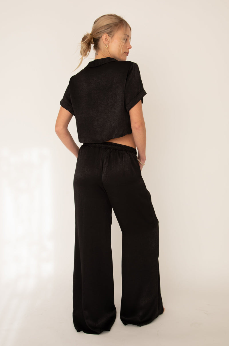 This is an image of Jagger Set in Black - RESA featuring a model wearing the dress