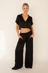 This is an image of Jagger Set in Black - RESA featuring a model wearing the dress