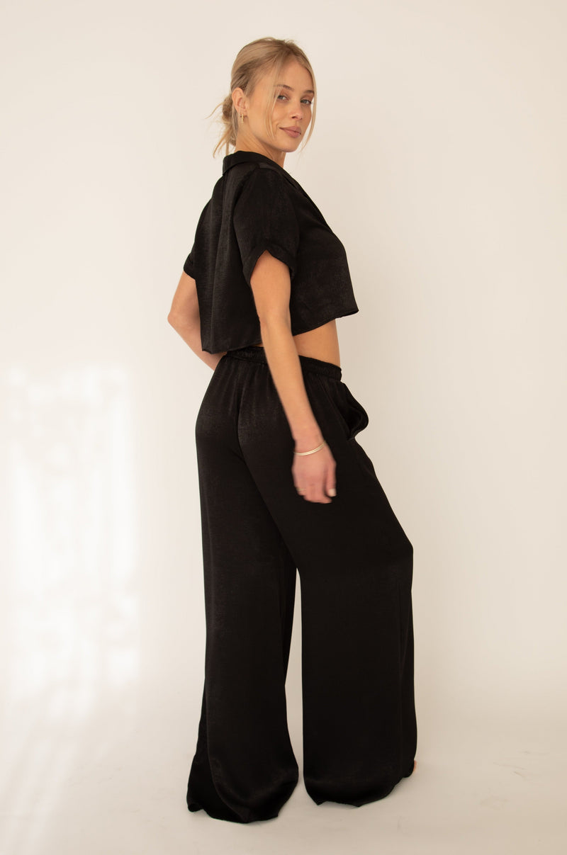 This is an image of Jagger Set in Black - RESA featuring a model wearing the dress