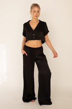 This is an image of Jagger Set in Black - RESA featuring a model wearing the dress