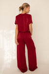 This is an image of Jagger Set in Burgundy - RESA featuring a model wearing the dress