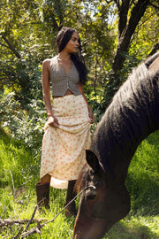 This is an image of Jamie Skirt in Wildflower - RESA featuring a model wearing the dress