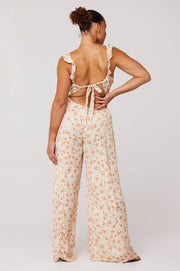 This is an image of Jilly Jumpsuit in Wildflower - RESA featuring a model wearing the dress