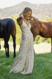 This is an image of Jilly Jumpsuit in Wildflower - RESA featuring a model wearing the dress