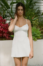 This is an image of Joelle Mini in Dove - RESA featuring a model wearing the dress