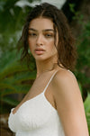 This is an image of Joelle Mini in Dove - RESA featuring a model wearing the dress