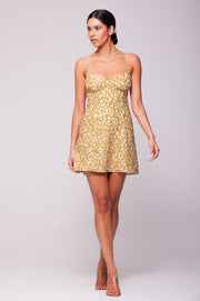 This is an image of Joelle Mini in Fava - RESA featuring a model wearing the dress