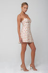 This is an image of Joelle Mini in Fawn - RESA featuring a model wearing the dress