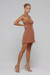 This is an image of Joelle Mini in Latte - RESA featuring a model wearing the dress