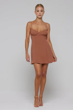 This is an image of Joelle Mini in Latte - RESA featuring a model wearing the dress