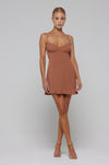 This is an image of Joelle Mini in Latte - RESA featuring a model wearing the dress
