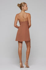 This is an image of Joelle Mini in Latte - RESA featuring a model wearing the dress