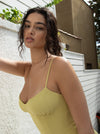 This is an image of Joelle Mini in Lime - RESA featuring a model wearing the dress