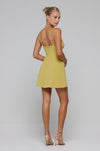 This is an image of Joelle Mini in Lime - RESA featuring a model wearing the dress