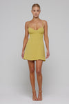 This is an image of Joelle Mini in Lime - RESA featuring a model wearing the dress